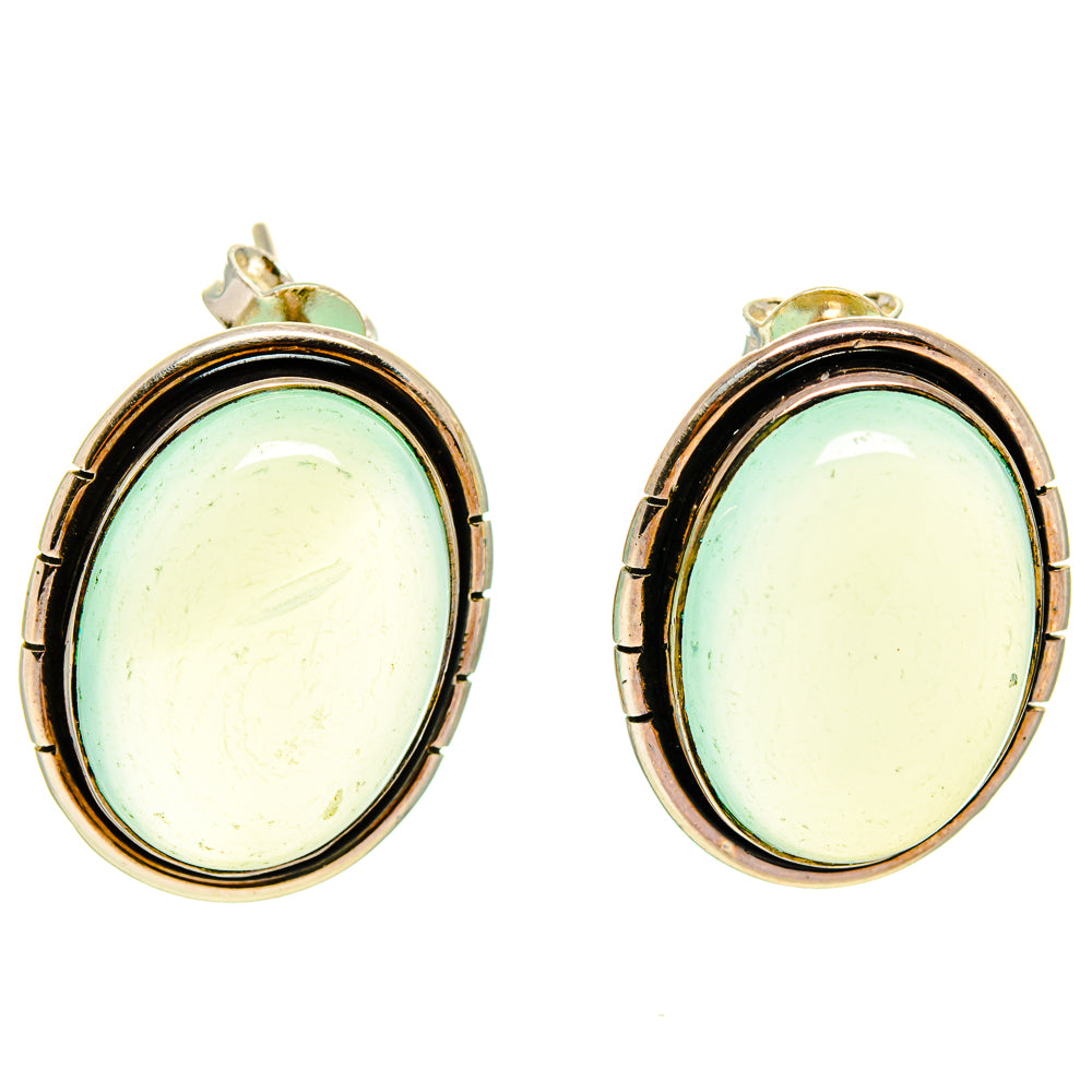 Oval aqua chalcedony stud earrings with gold-tone posts and silver bezel