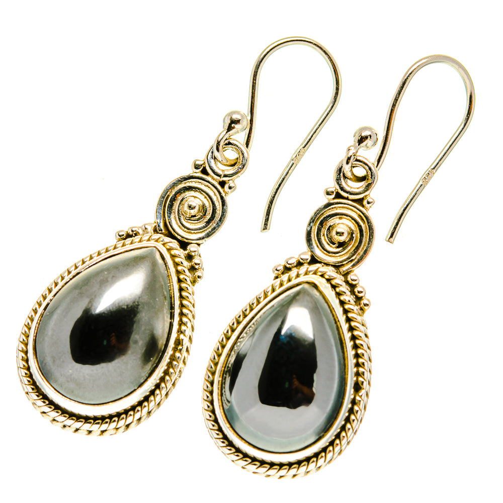Gold-tone teardrop hematite earrings, scalloped bezel, lever hooks