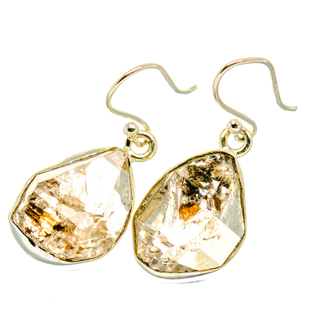 Teardrop gemstone earrings with faceted light-reflecting stones and metal hooks