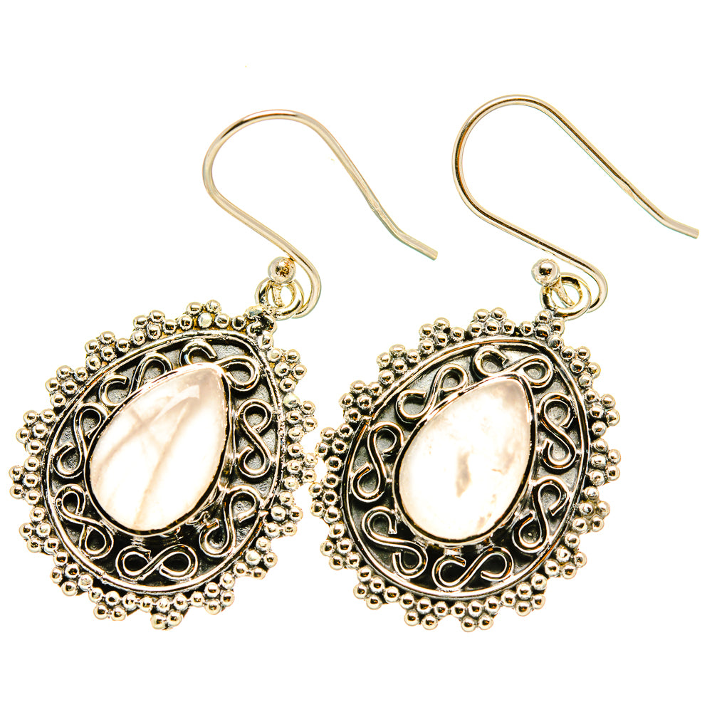 Rose quartz teardrop earrings with ornate filigree settings and fishhook backs