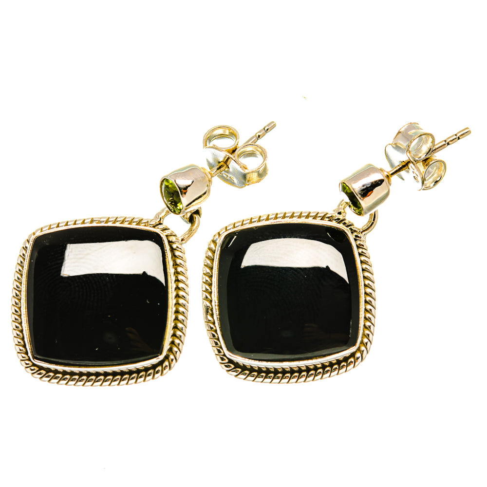 Gold square drop earrings with black onyx-like stones and round peridot-green accents