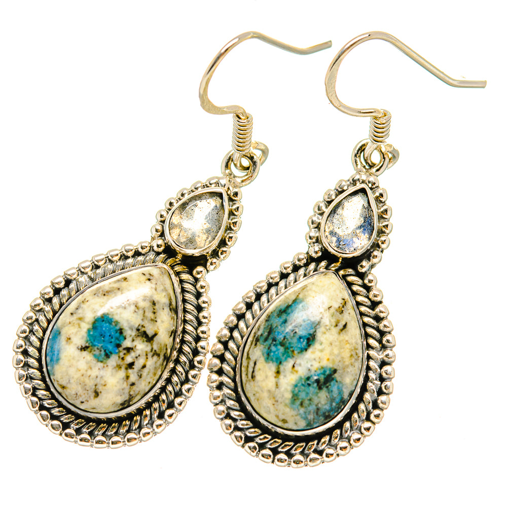 Teardrop labradorite earrings with blue speckled stones and ornate silver-tone frames