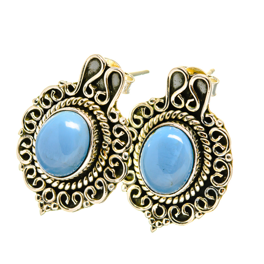 Blue opal stud earrings with round cabochon and ornate gold-tone filigree settings