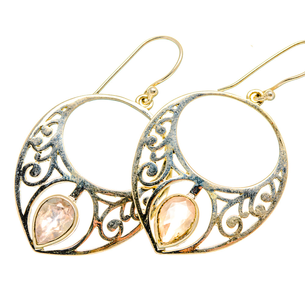 Rose quartz earrings with openwork silver hoop settings and round pink stones
