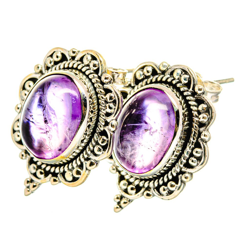 Amethyst 925 sterling silver stud earrings with oval purple gemstones, detailed filigree settings