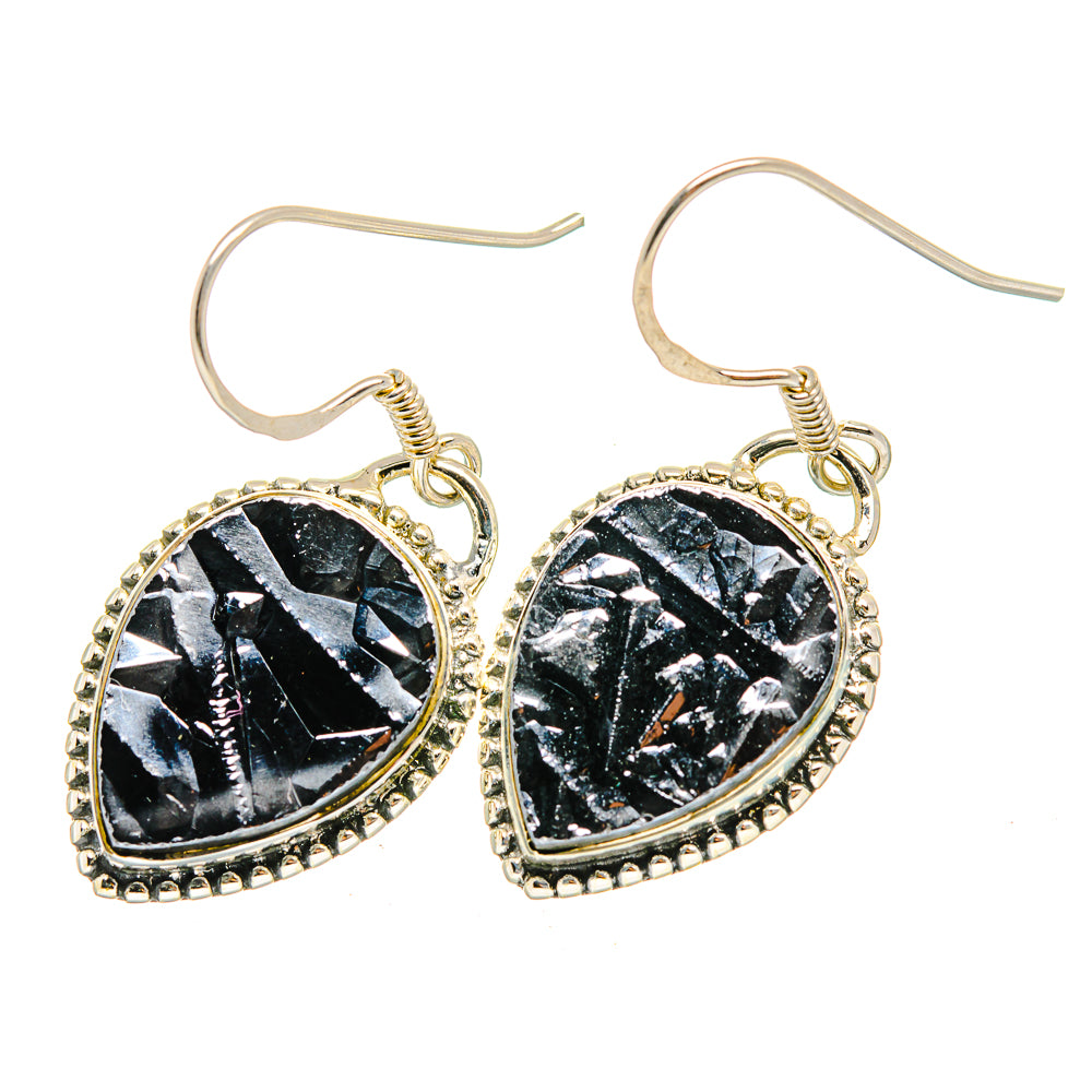 Pair of black rough stone teardrop earrings with silver-tone beaded edge and hooks