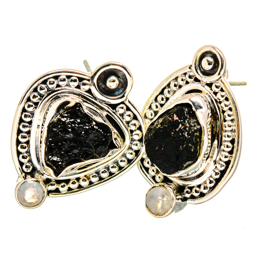 Sterling silver drop earrings with rough black oval stones, beaded halos, and moonstone dangles