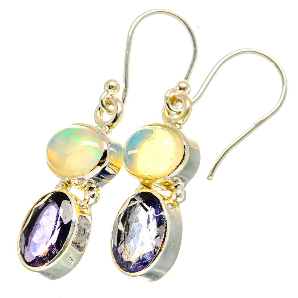 Sterling silver drop earrings with yellow opal-like round stones and purple oval pendants