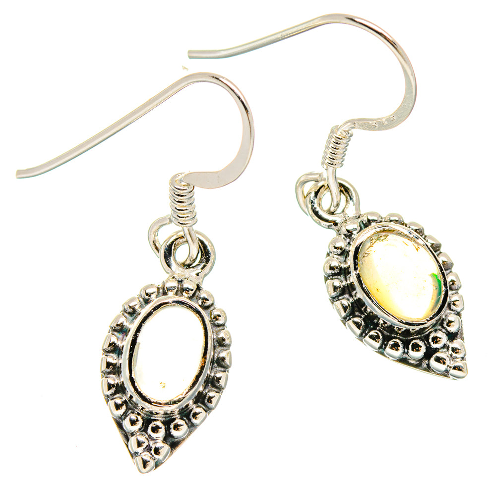 Sterling silver opal drop earrings with oval yellow stone in ornate bezel and hook backs