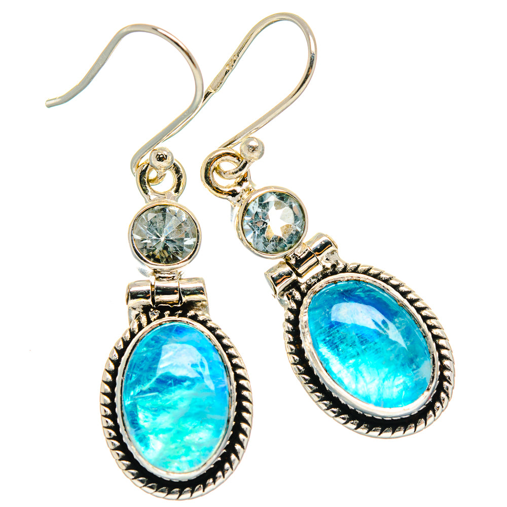 Sterling silver drop earrings with oval blue gemstone and round stone accents