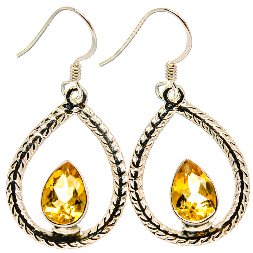Sterling silver teardrop earrings with faceted yellow citrine center and rope border