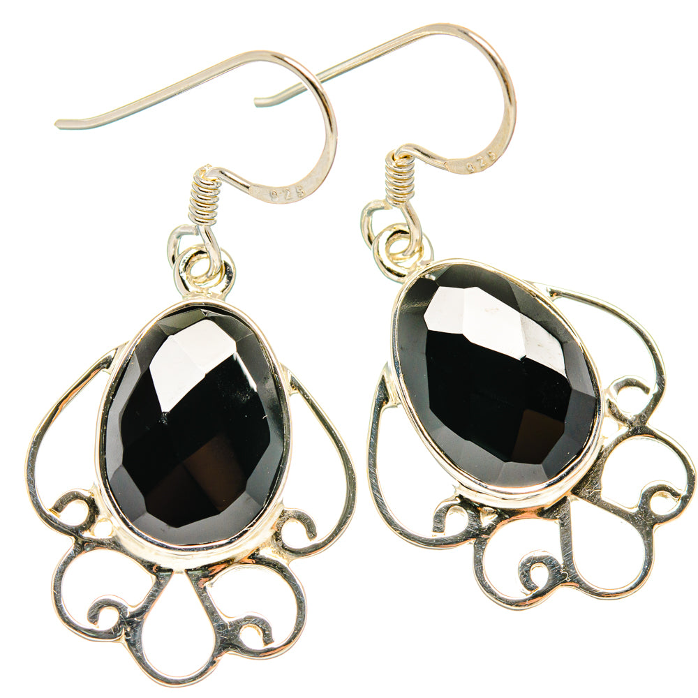 925 sterling silver black onyx teardrop earrings with ornate scroll filigree and hook closures.