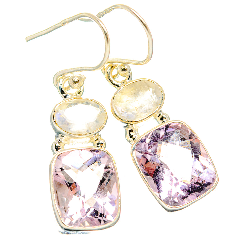 Gold-tone drop earrings with oval moonstone-like center and faceted pink teardrop stones