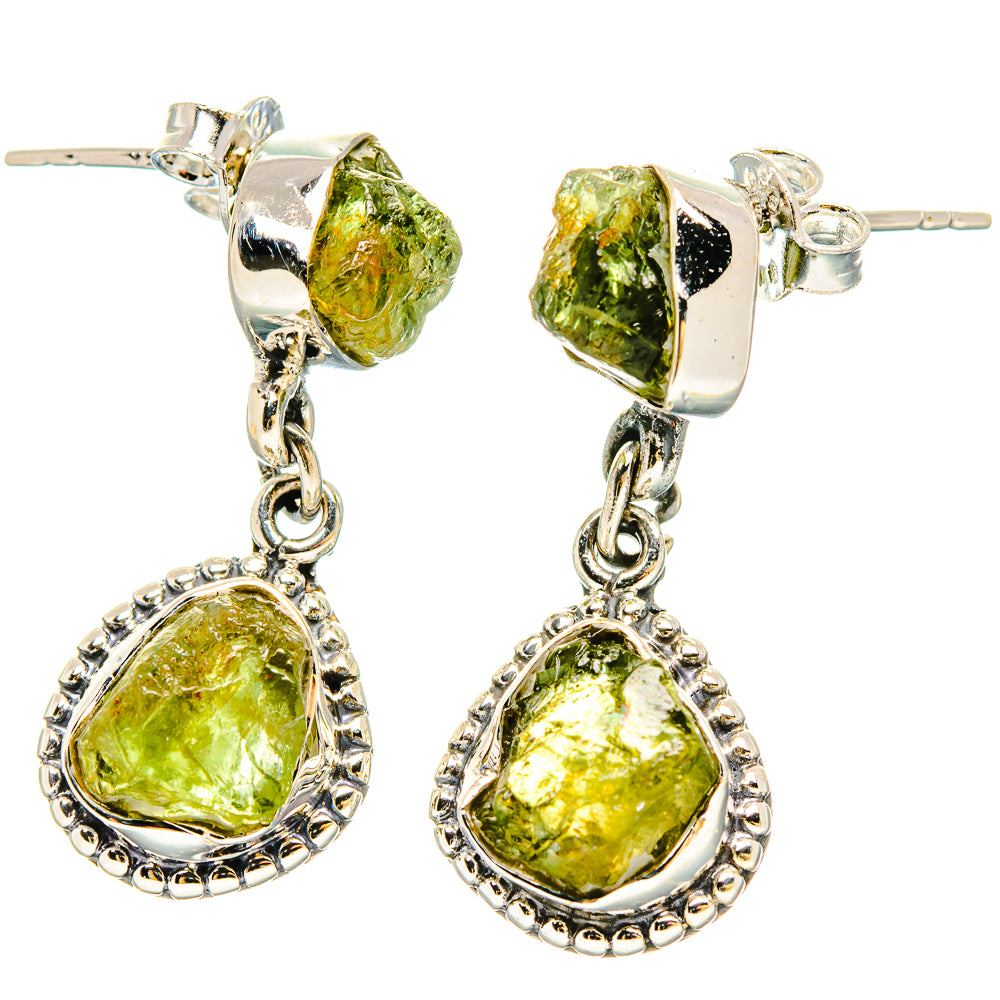 Sterling silver dangle earrings with rough green peridot stones and bead trim