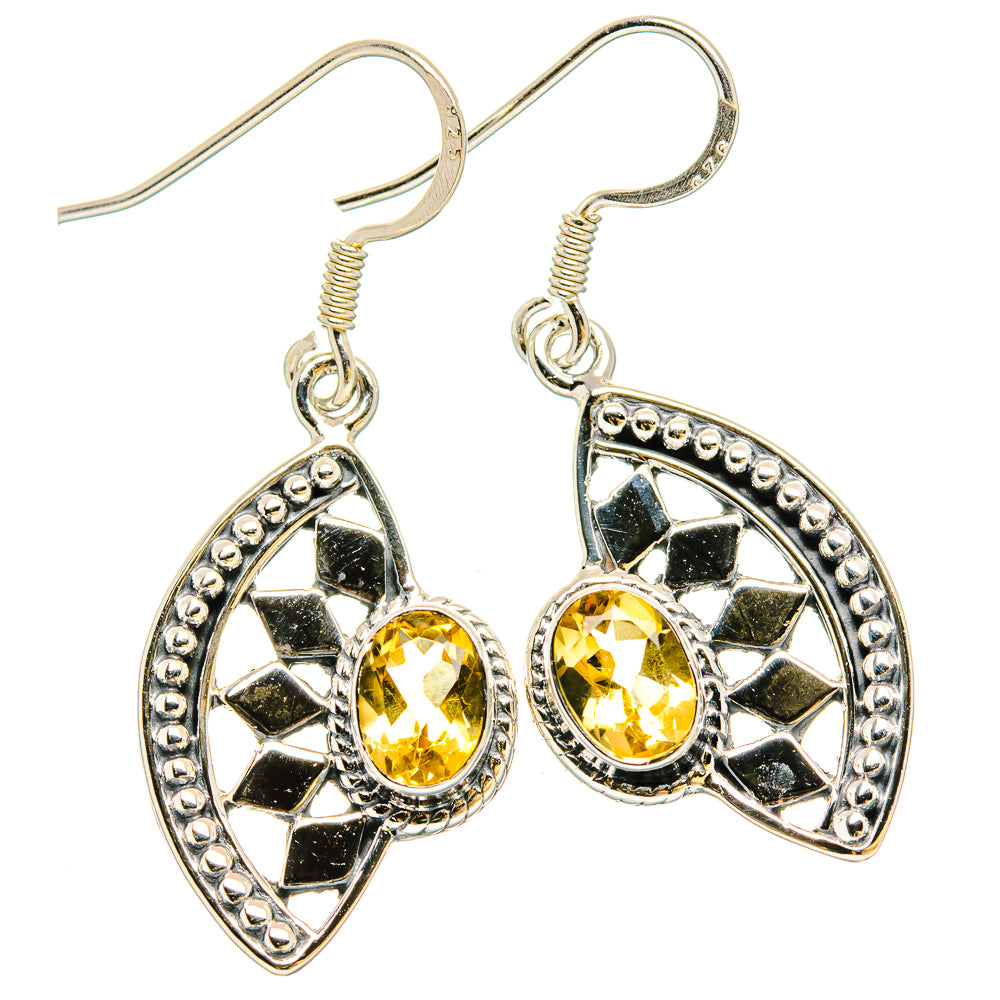 Oval citrine drop earrings in 925 sterling silver with black enamel starburst detail