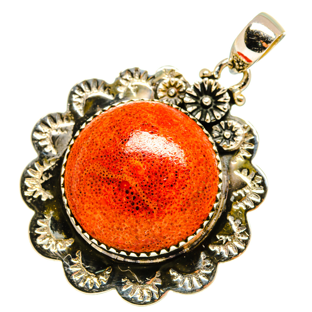 Orange coral cabochon pendant with floral silver frame and loop bail