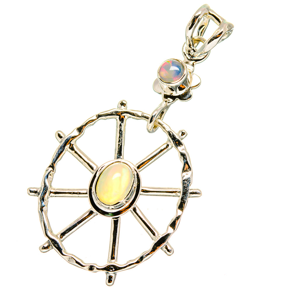 Sterling silver opal pendant with round cabochon and starburst wheel design