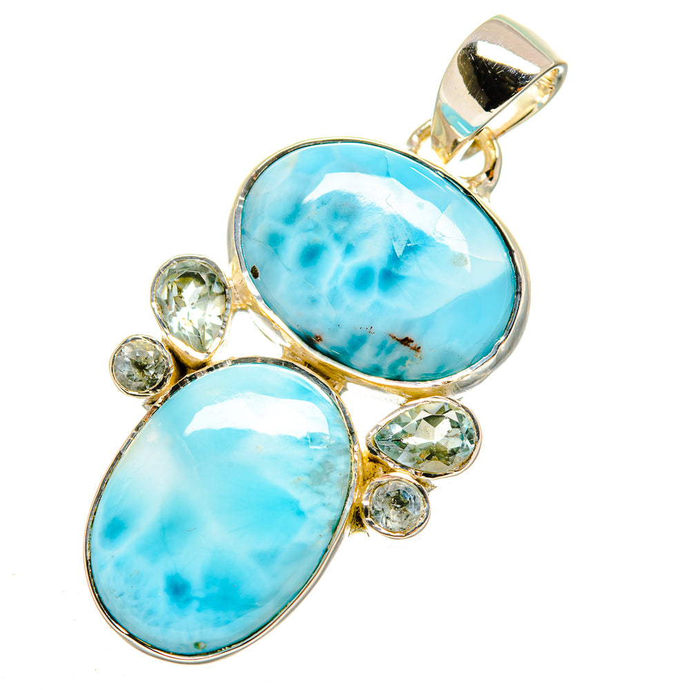 Sterling silver pendant with oval light-blue cabochon and round bezel-set stones, bail on top