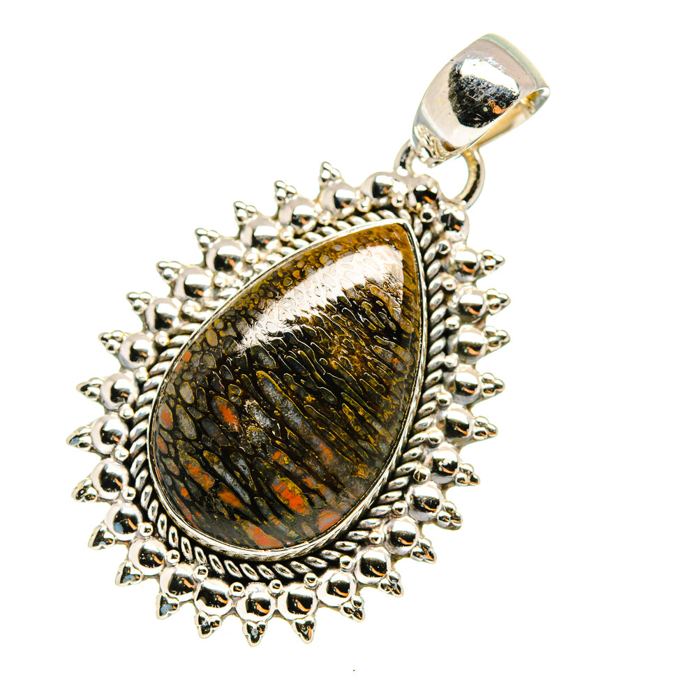 Sterling silver teardrop pendant with fossil-like stone center and scalloped bezel, bail top