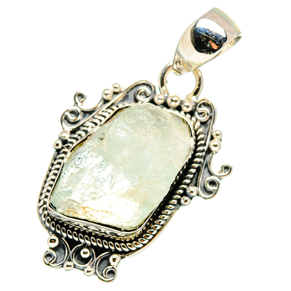 Sterling silver rough oval pale blue gemstone pendant with ornate filigree and bail