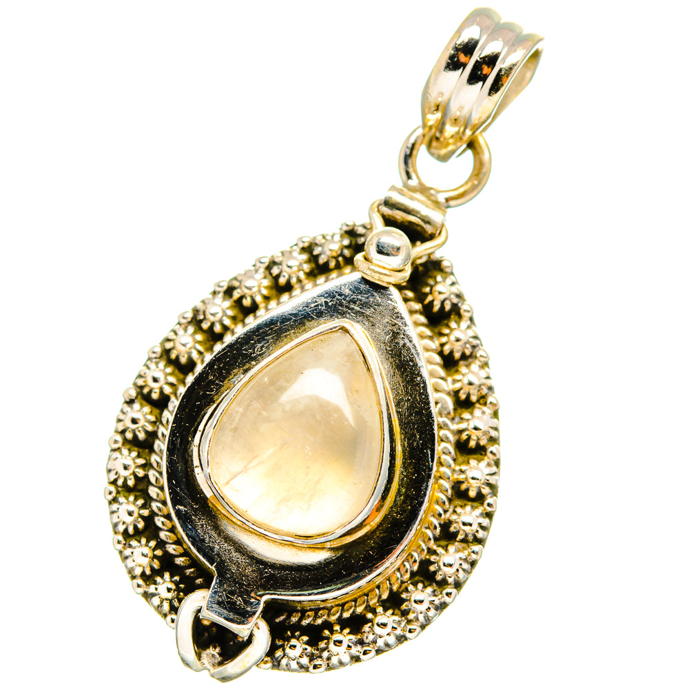 Teardrop moonstone pendant with ornate gold-tone beaded silver setting and bail