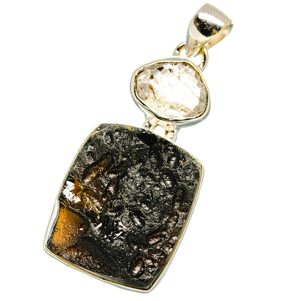 Sterling silver pendant showing clear oval crystal top and dark textured square tektite