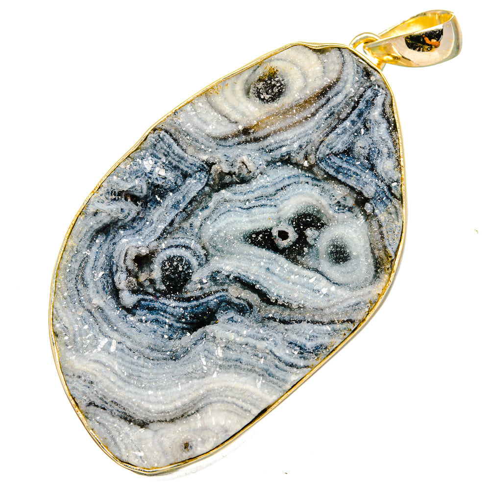 Teardrop druzy pendant showing blue-gray swirled stone, gold-toned frame and bail