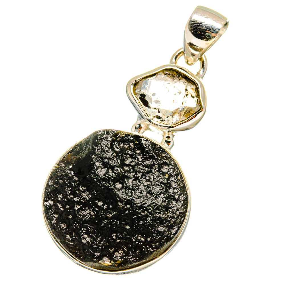 Sterling silver tektite pendant with black oval stone and small clear crystal top
