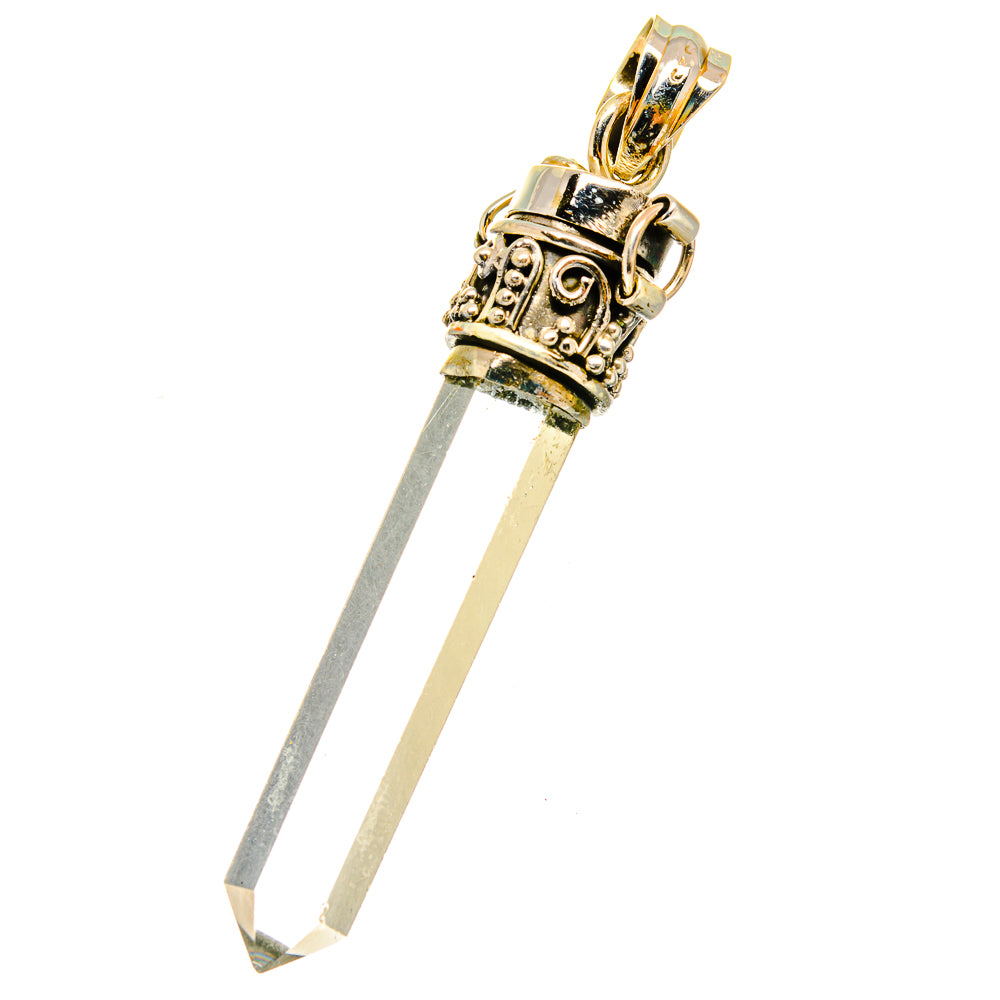 Quartz crystal pendant with faceted white stone and gold bail, long silver prongs