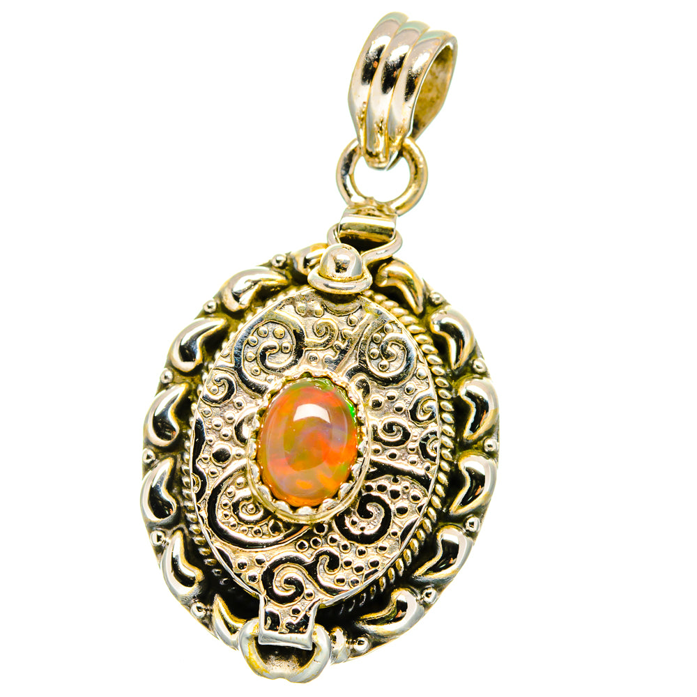 Ornate oval opal pendant with orange center, two-tone bail in sterling silver setting