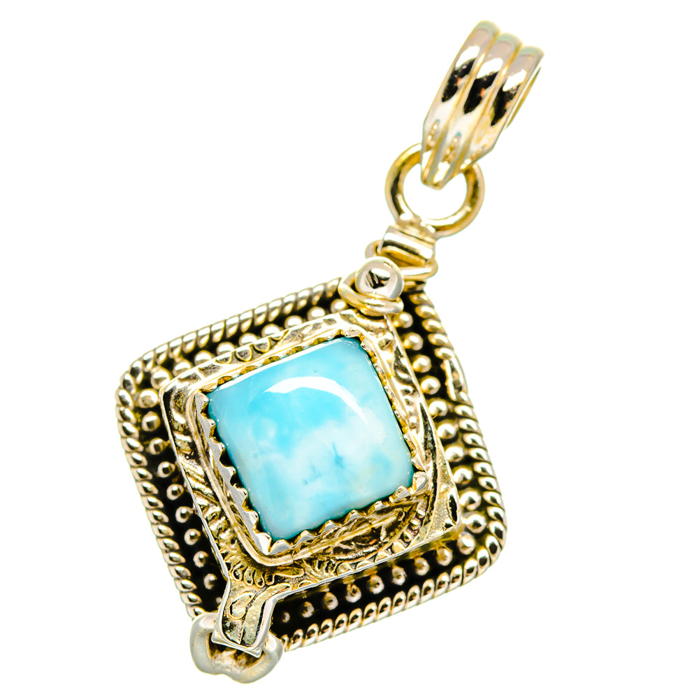 Ornate sterling silver Larimar poison pendant with hanging bail and blue square stone.