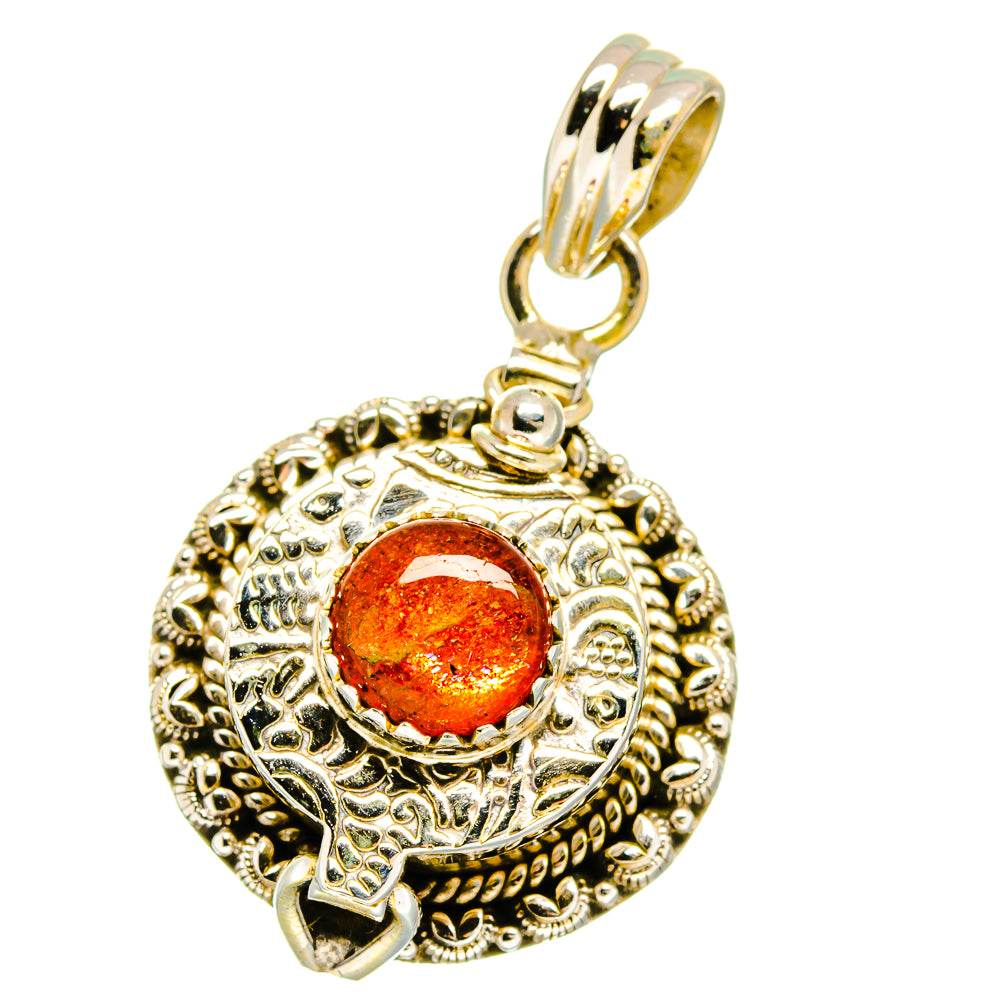 Gold-tone 925 sterling silver poison pendant with orange sunstone cabochon, ornate bezel