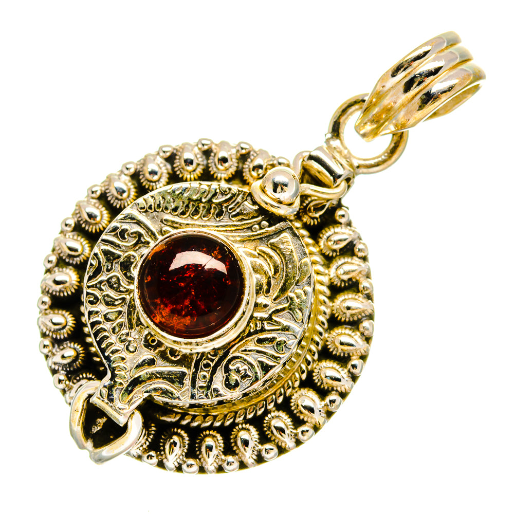 Ornate 925 sterling silver garnet pendant with red round gemstone and textured border