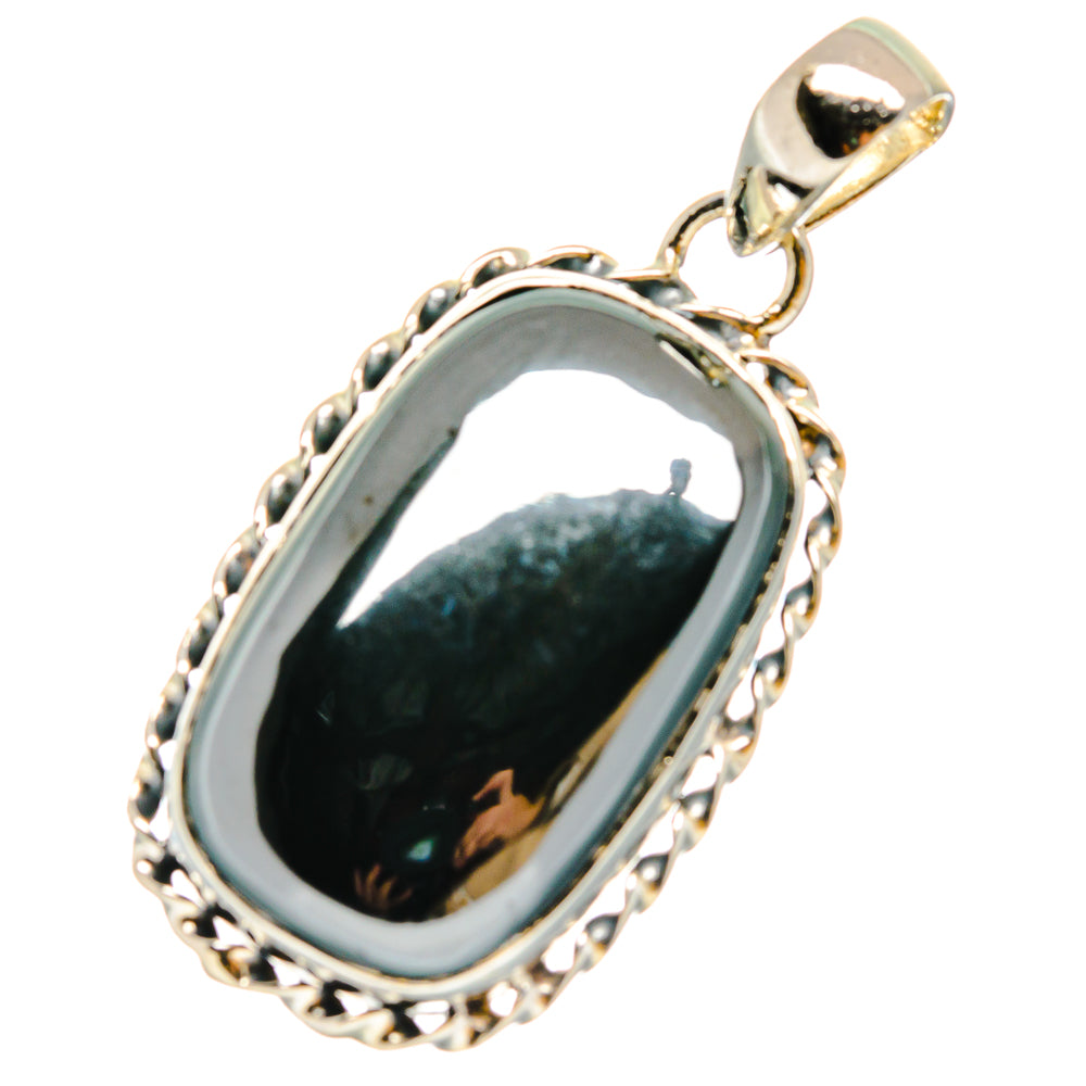 Hematite pendant with oval dark hematite stone, silver bezel and loop bail