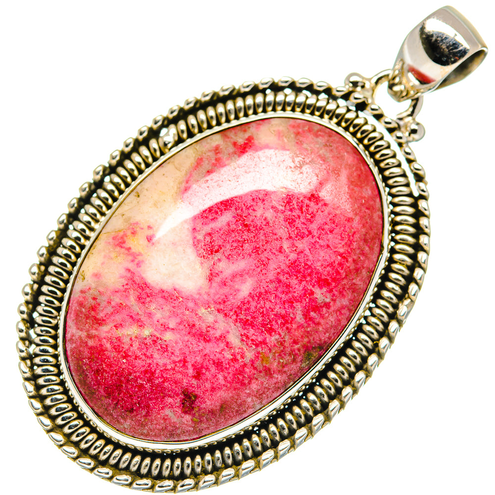 Oval rhodochrosite pendant with red-and-pink marbled stone, beaded silver frame