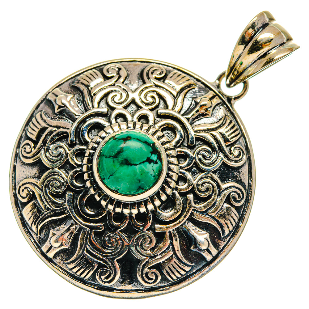 Round sterling silver pendant with teal turquoise cabochon and ornate filigree border