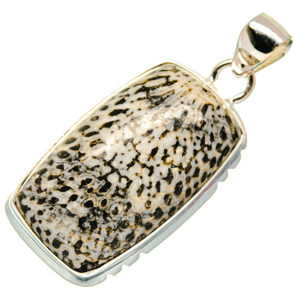 Sterling silver pendant with rounded rectangle frame and black-speckled cream inlay, bail top