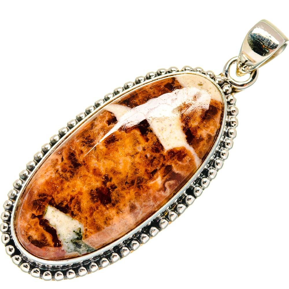 Muscovite pendant with amber-brown teardrop stone frame, beaded border, and silver bail