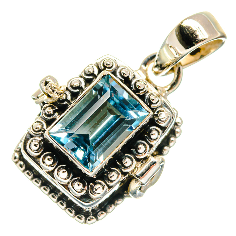 Sterling silver pendant with rectangular blue topaz gemstone and ornate frame
