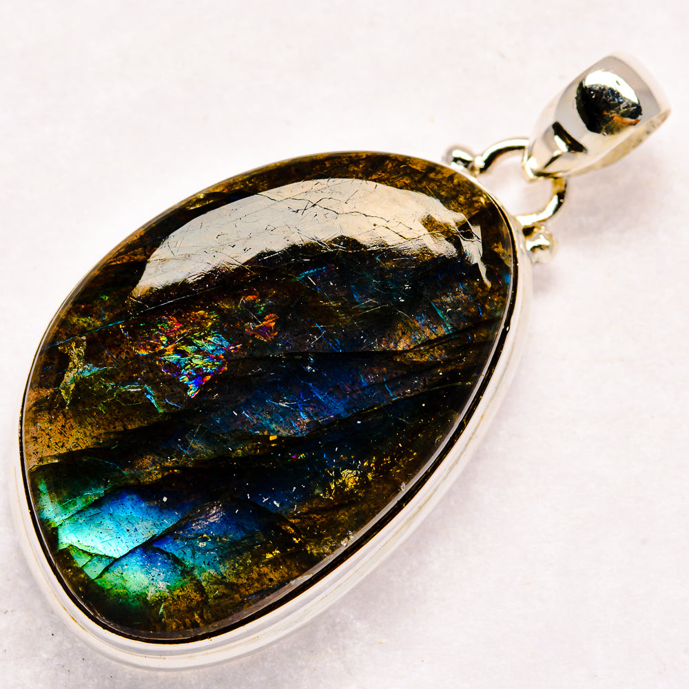 Labradorite gemstone teardrop pendant in sterling silver setting with bail