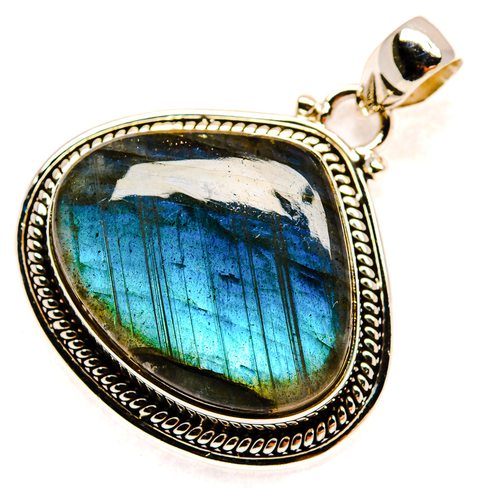 Labradorite pendant with oval bezel, blue-green labradorescence and silver bail