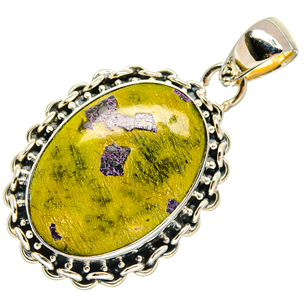 Oval sterling silver pendant with oval green stone and purple accents, scalloped frame