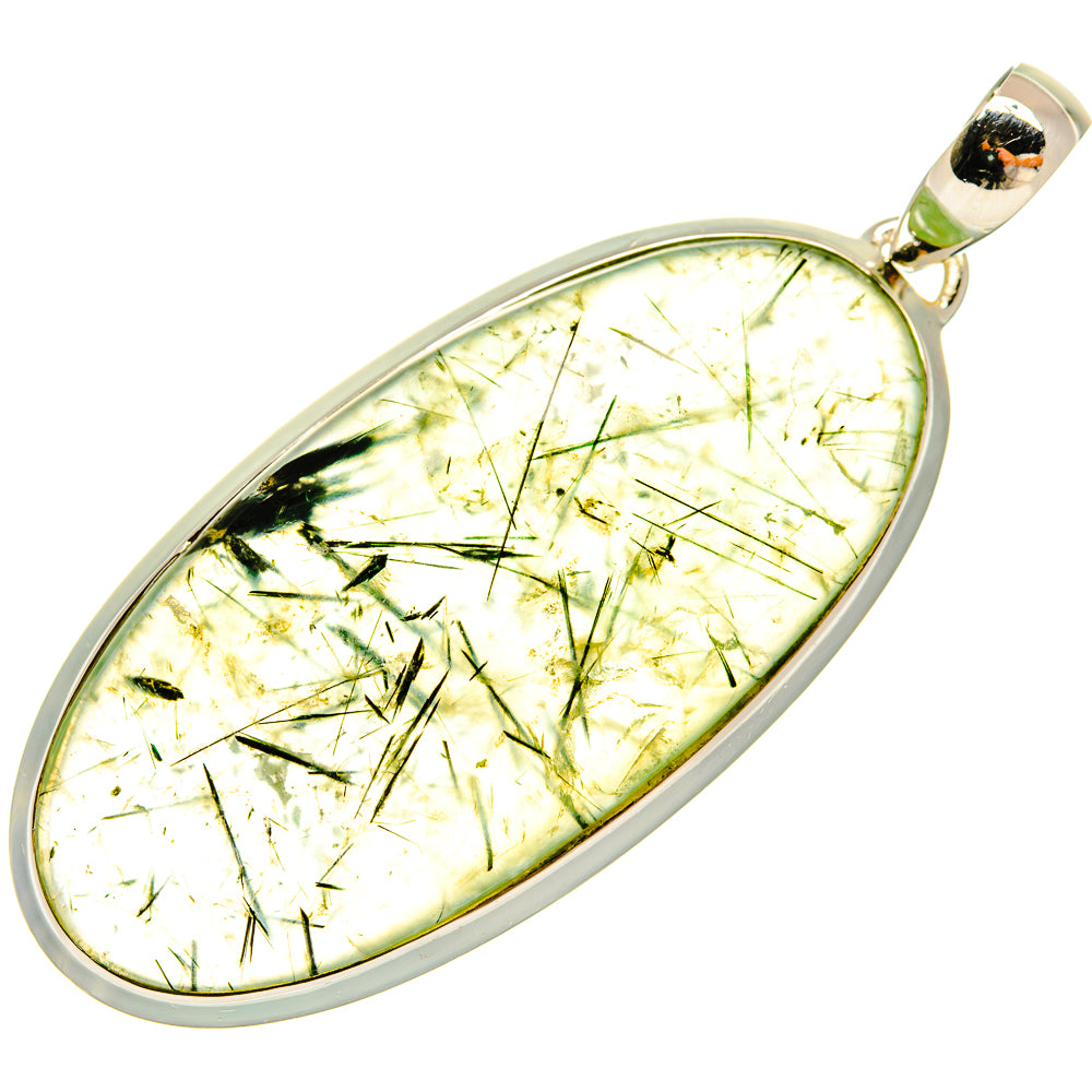 Oval prehnite pendant with silver border and green needle-like inclusions