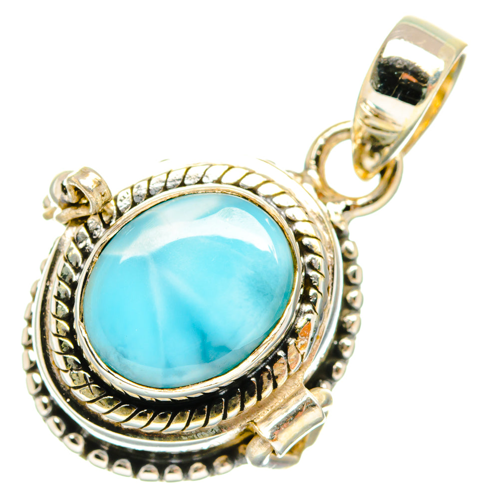 Sterling silver larimar oval pendant with ornate bezel and loop bail, light blue stone