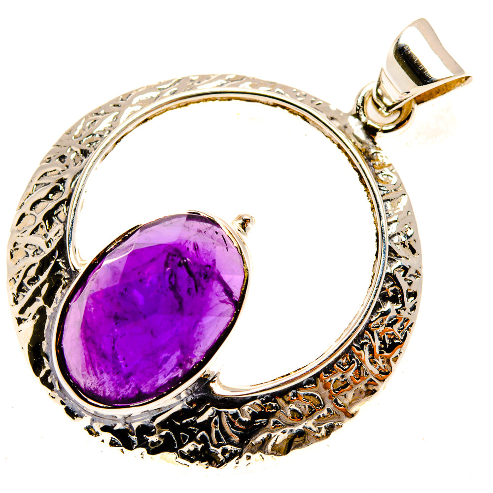 Sterling silver amethyst pendant with oval purple gemstone and ornate round frame