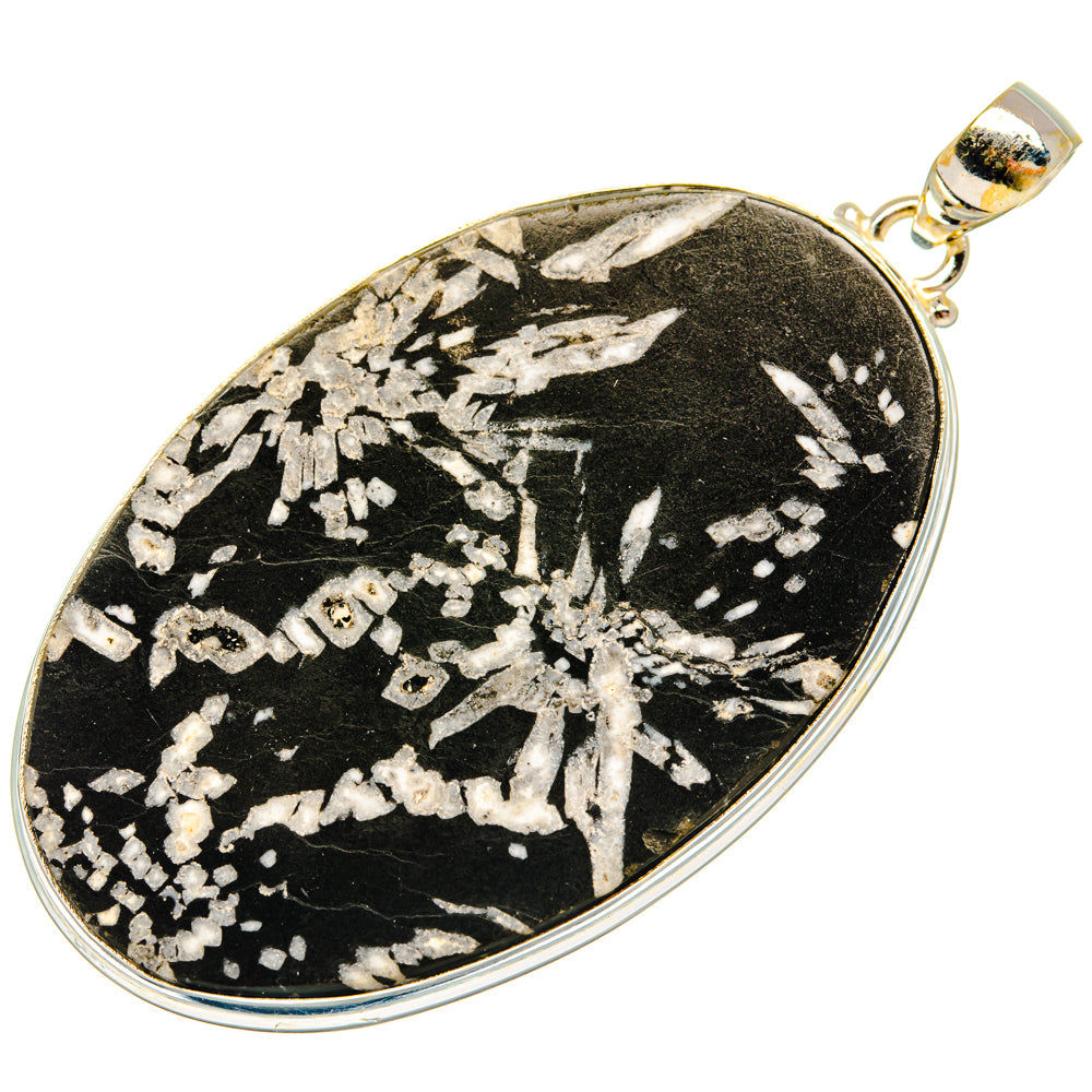 Black stone oval pendant with silver-tone chrysanthemum pattern in sterling silver bezel