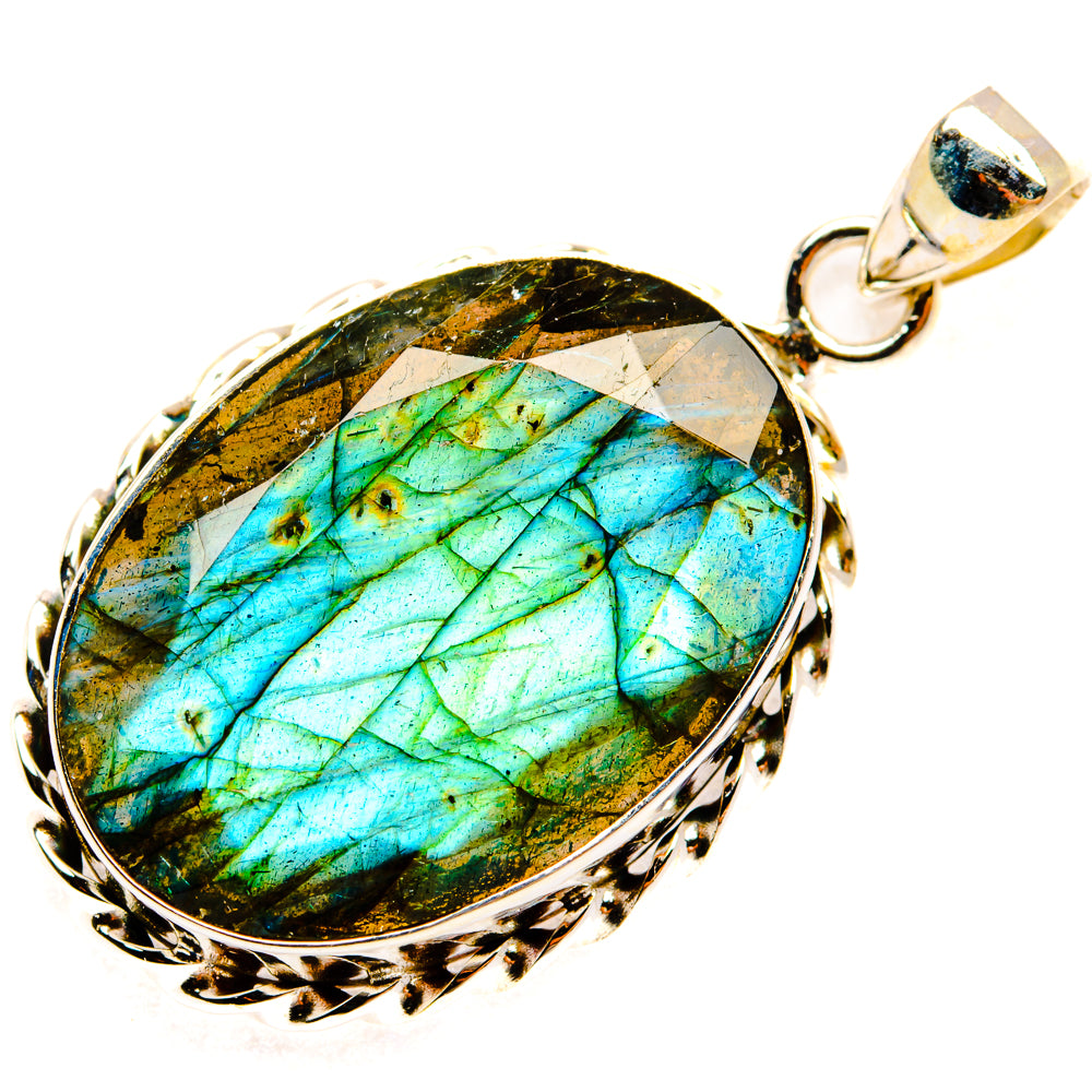 Round sterling silver labradorite pendant with vivid turquoise-blue iridescence, bail top