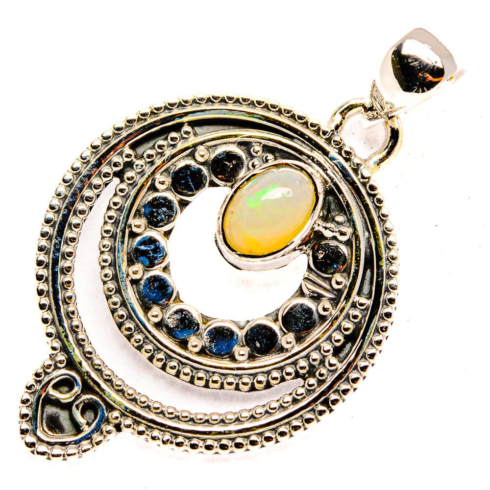 Sterling silver opal pendant with teardrop bail, oval opal center, and blue stone halo