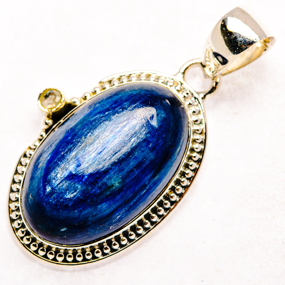 Oval blue kyanite pendant with beaded sterling silver bezel and bail