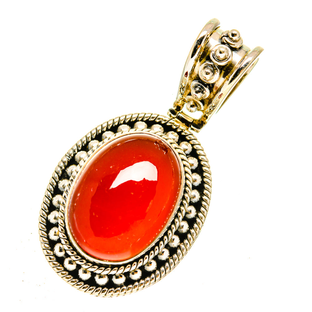 Oval red onyx pendant with beaded sterling silver frame and gold-tone top loop